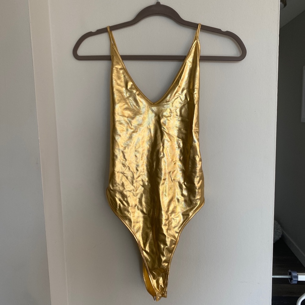 Gold bodysuit with open criss cross crossed back